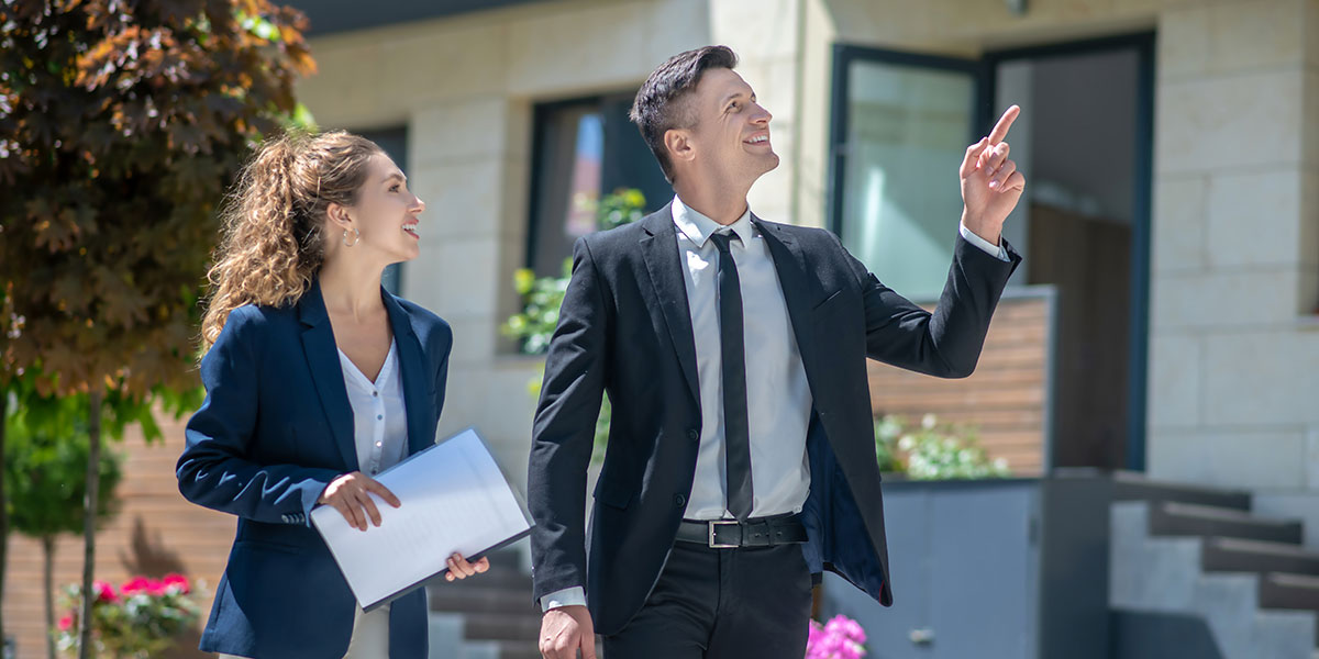 Two professionals looking at houses and finding deals for fix and flip