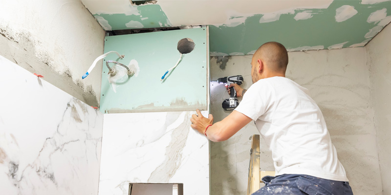 real estate investor renovating the bathroom of a fix and flip project