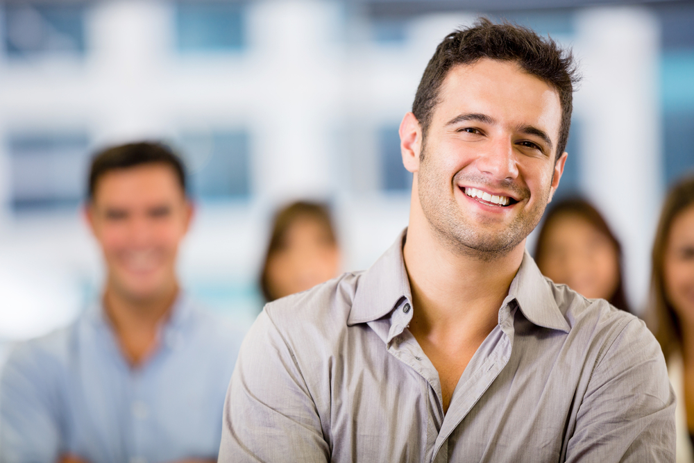 confident male real estate investor smiling