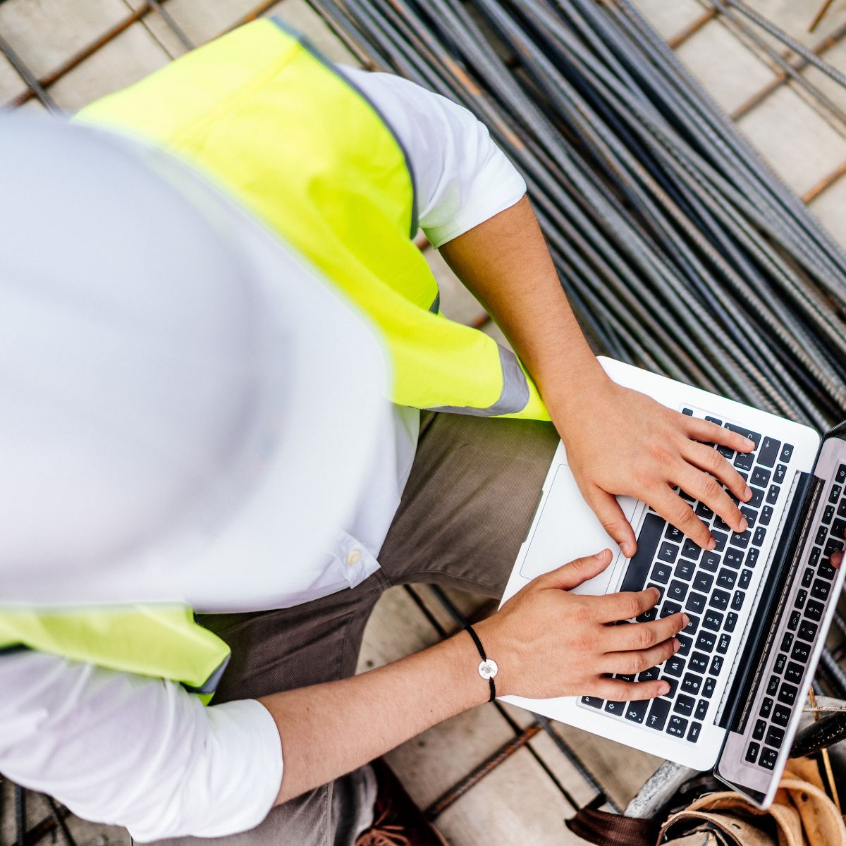 New-Construction_REI_Looking_at_laptop