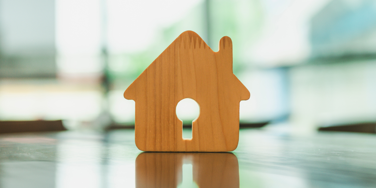 Close up of a small wooden model of a house